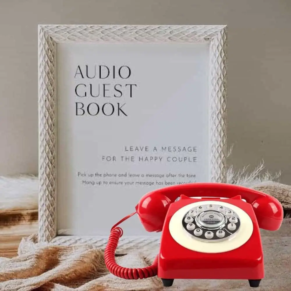Red Classic50 Red retro telephone next to a frame with the Audio Guest Book instructions