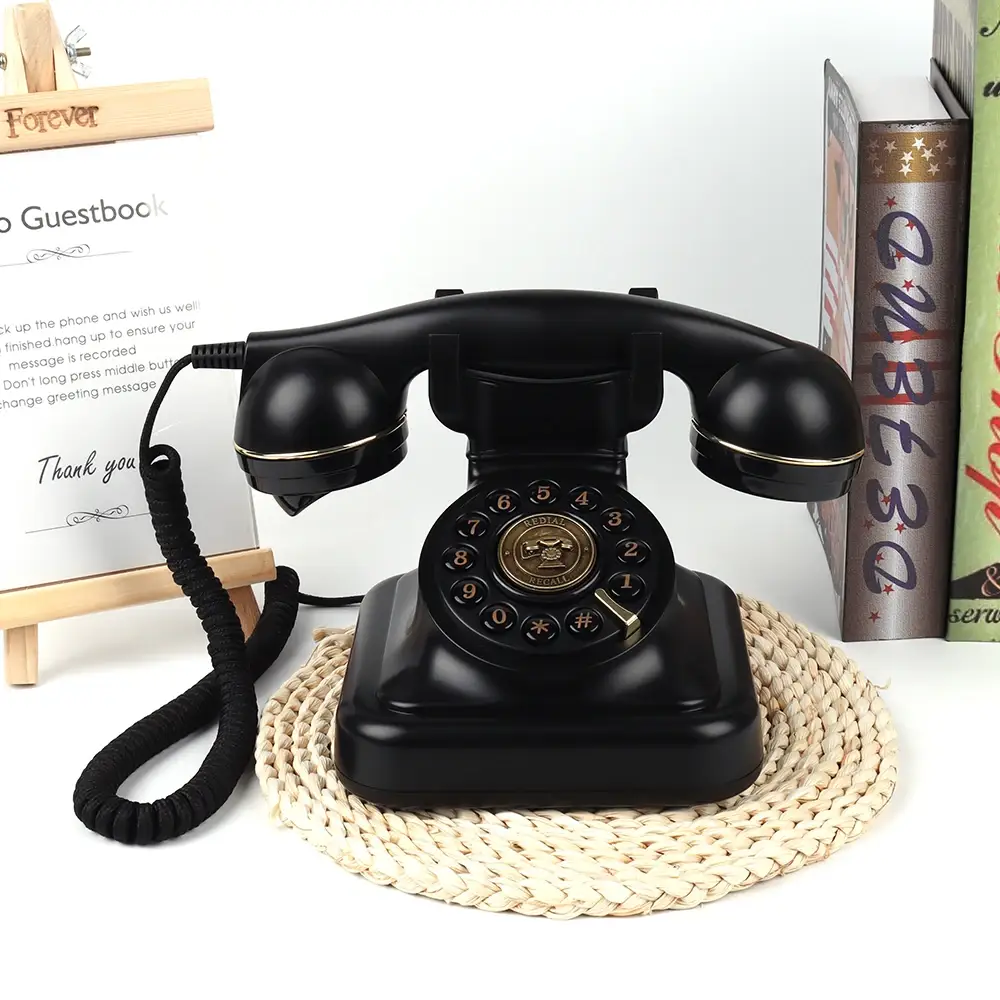 Чёрный ретро телефон Elegance70 Black на плетёной подставке рядом с инструкцией