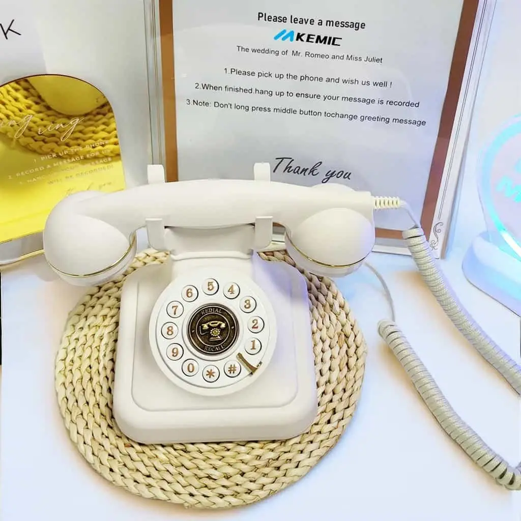 White phone on a woven stand, in front of a sign with instructions for guests