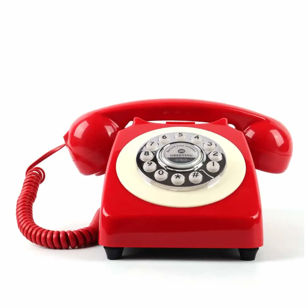 Red Classic50 Red retro telephone, front view, on a white background